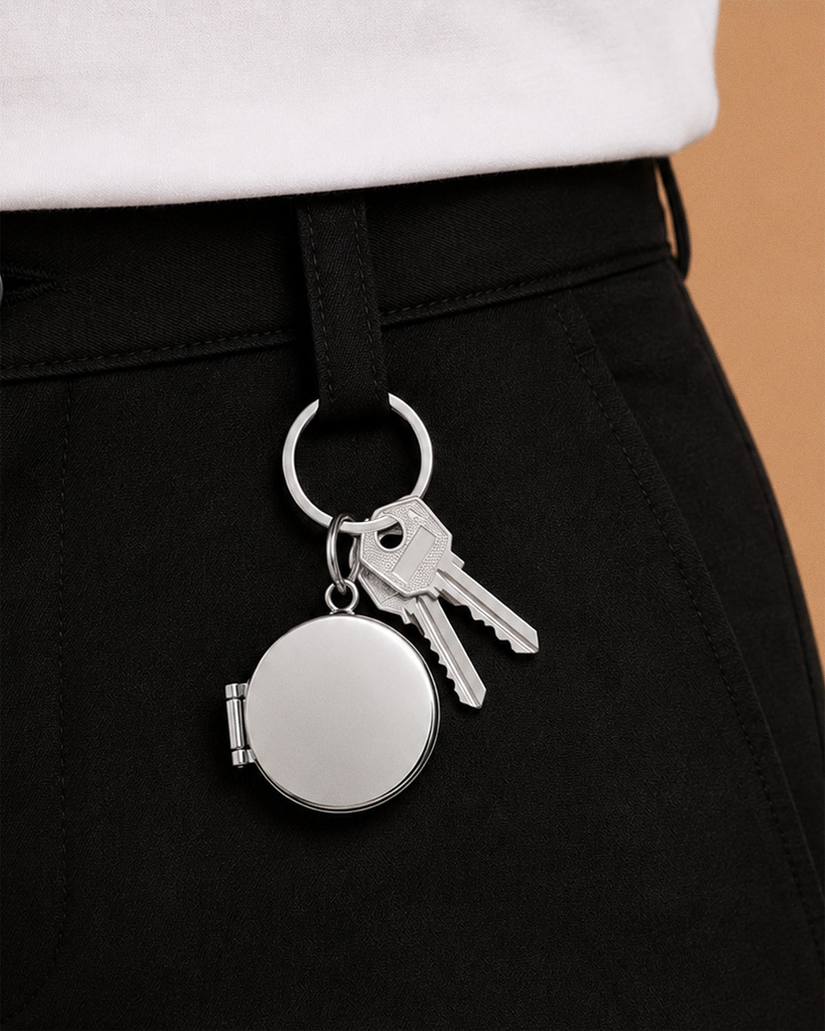 Round Stainless Steel Key Chain Photo Locket - on model