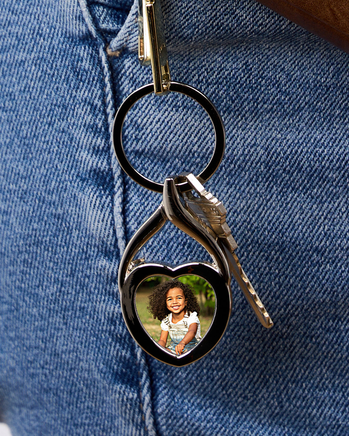 Stainless Steel Engravable Heart Photo Laser Keychain - Stainless Steel 1 1/4 Inch Wide x 1 Inch Tall - on model