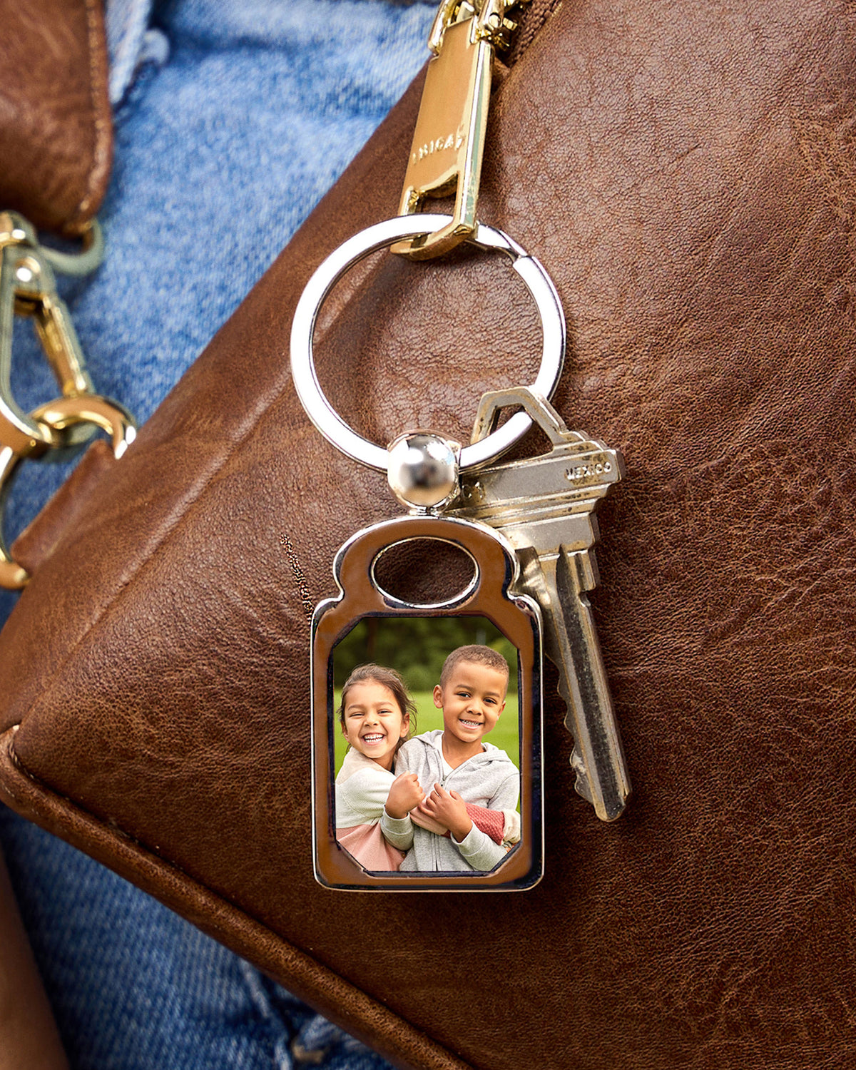 Stainless Steel Engravable Rectangle Photo Laser Keychain - Stainless Steel 1 1/4 Inch Wide x 1 3/4 Inch Tall - on model