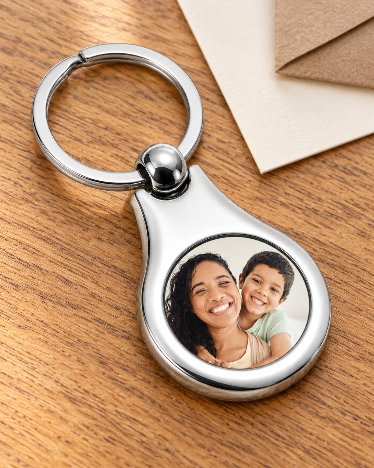 Stainless Steel Engravable Round Photo Laser Keychain - Stainless Steel 1 1/4 Inch Wide x 1 Inch Tall - on model
