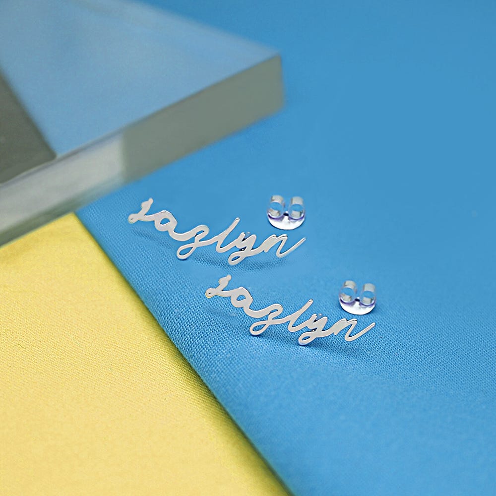 Pair Of Minimalist Script Name Earrings